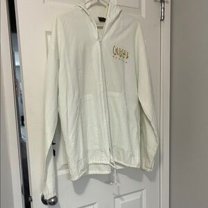 White zippered hoodie. Cancun graphics on front,back and sleeves. 100% cotton
